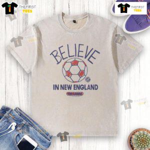 Good New England Revolution Homage MLS x Ted Lasso Believe washed t-shirt featuring iconic design and vibrant colors.