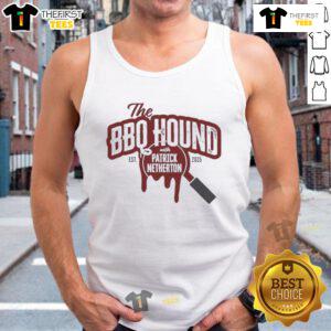 Nice the BBQ Hound wearing a tank top with Patrick Netherton at the 2025 BBQ festival, showcasing summer fun.
