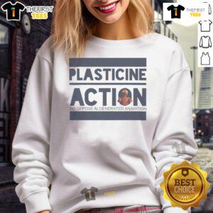 Protester arrested wearing 'Plasticine Action' sweatshirt at a climate demonstration, highlighting environmental activism.