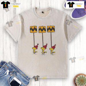 Funny Hot Woodstock Peanuts Christmas details on yellow and black Charlie Brown washed t-shirt for festive style.