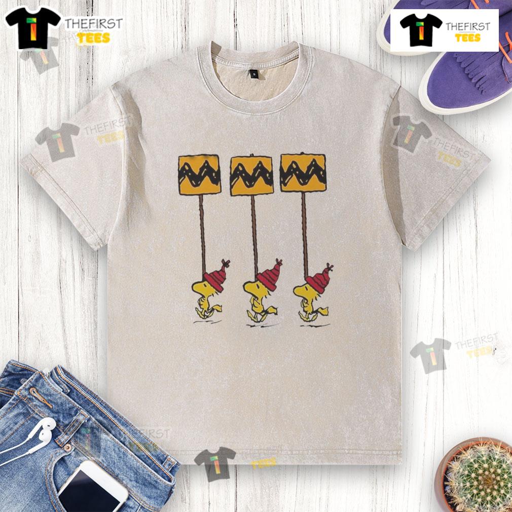 Funny Hot Woodstock Peanuts Christmas details on yellow and black Charlie Brown washed t-shirt for festive style.