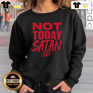 Cozy 'Nice Not Today Satan' Carolina Hurricanes sweatshirt in vibrant team colors, perfect for fans and chilly game days.