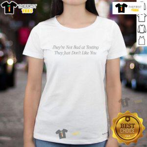 Nice They're Not Bad at Texting Ladies Tee featuring a witty quote about texting and relationships on a stylish shirt.