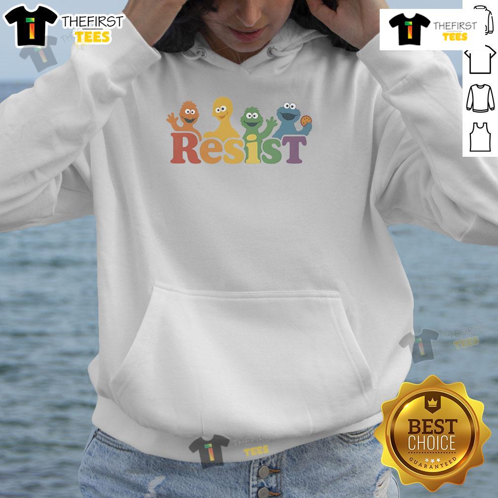 Person wearing a 'Top Public Broadcasting Protest PBS Resist Hoodie' at a demonstration advocating for public broadcasting.