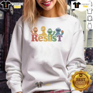 Person wearing a Top Public Broadcasting Protest PBS Resist sweatshirt at a rally, promoting public media advocacy.