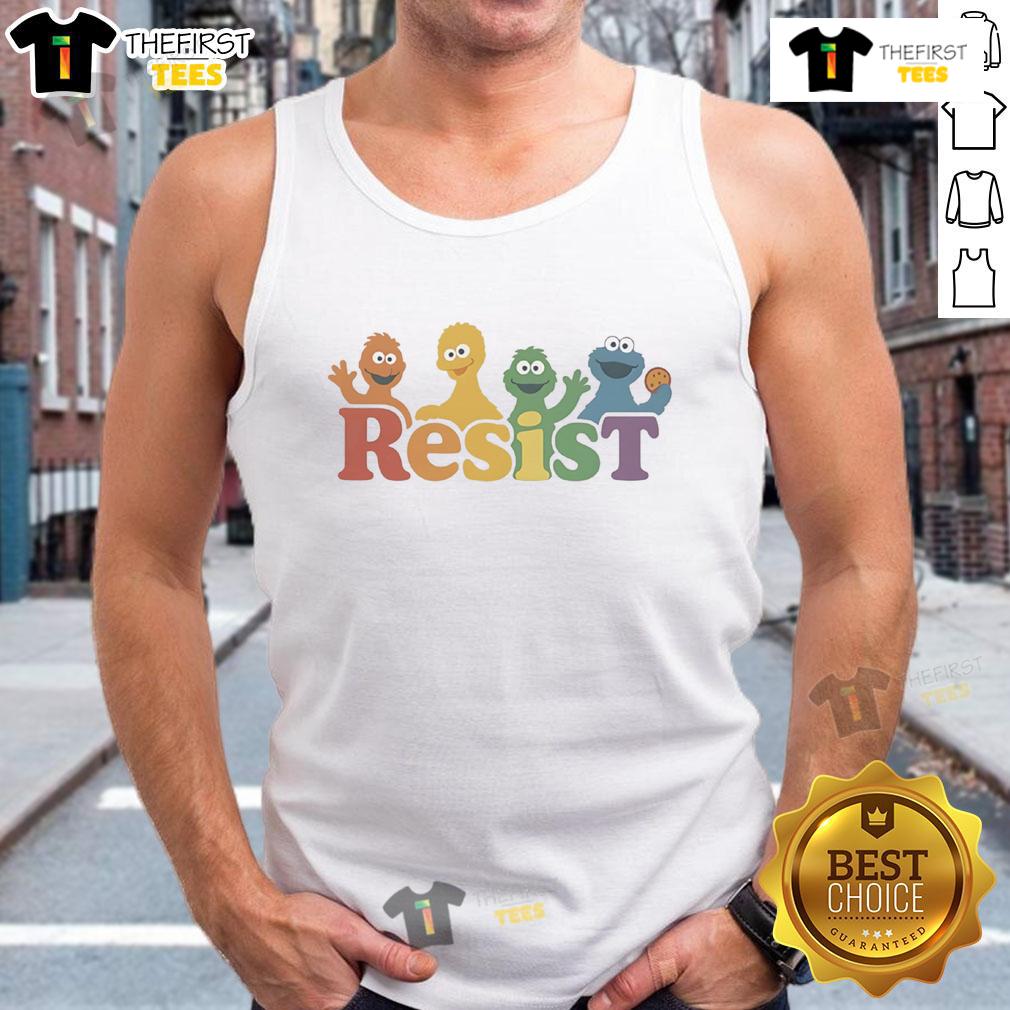 Alt Text: Woman wearing 'Resist' tank top at Top Public Broadcasting protest supporting PBS funding and free media.