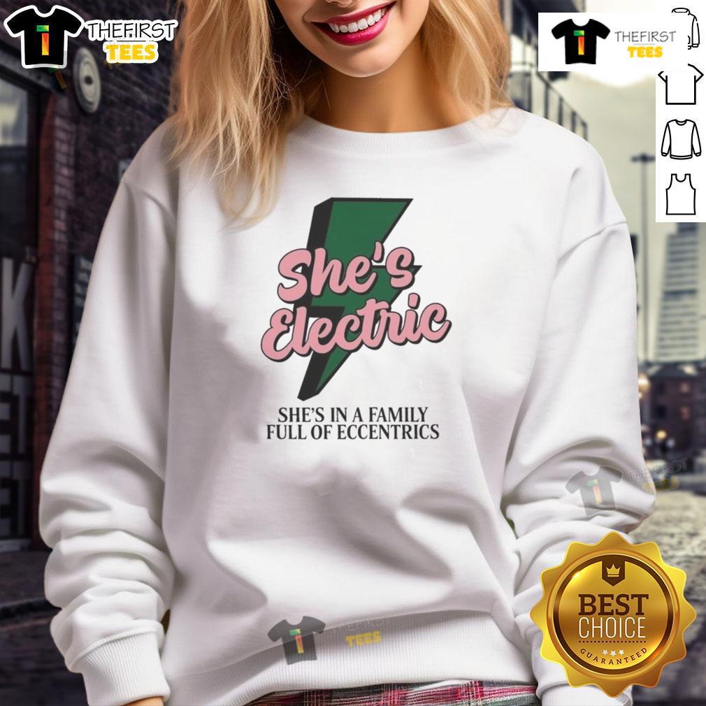 Alt Text: Top She's Electric sweatshirt featuring a quirky design, perfect for fans of eccentric family apparel.