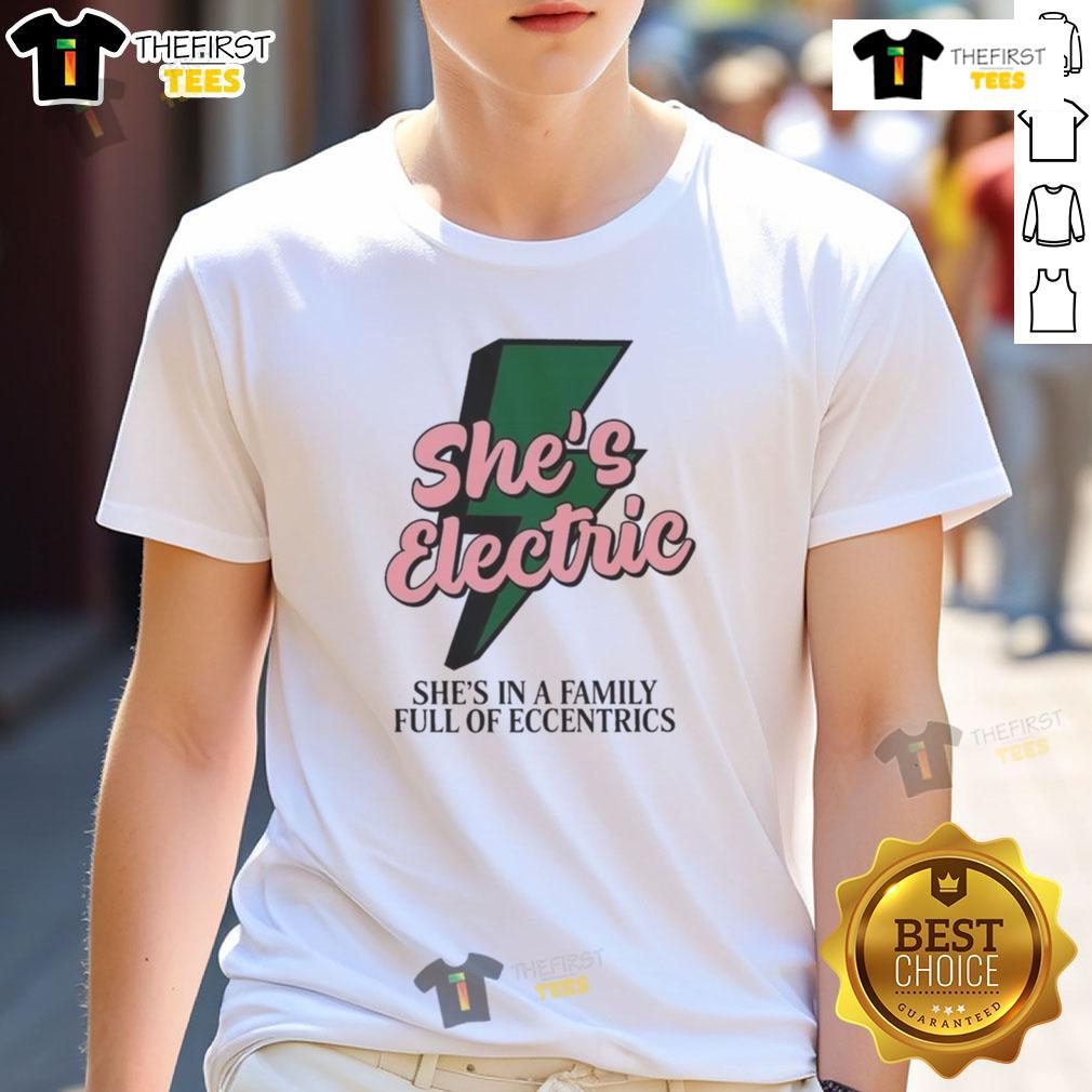 Top She's Electric She's In A Family Full Of Eccentrics T-Shirt featuring vibrant design and quirky text for unique style.