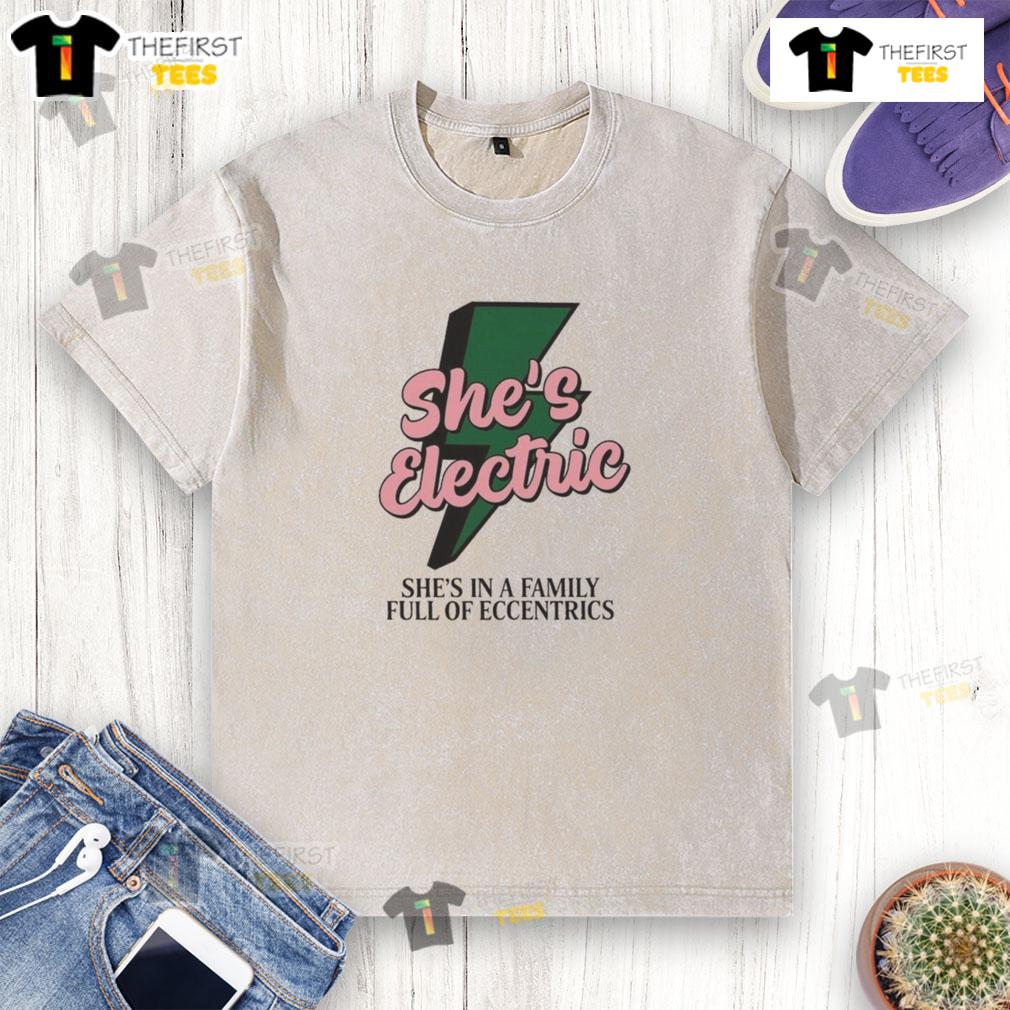 Alt Text: Top She's Electric She's in a Family Full of Eccentrics washed t-shirt featuring vibrant graphics and a relaxed fit.