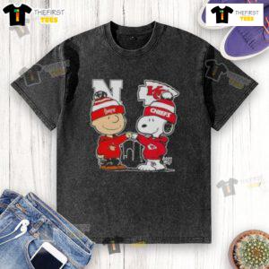 Top Snoopy and Charlie Brown Nebraska Huskers x Kansas City Chiefs skyline washed t-shirt design featuring iconic characters.