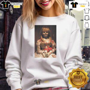 Alt Text: Top-The-Conjuring-Last-Rites-Annabelle Sweatshirt featuring spooky designs inspired by The Conjuring series.