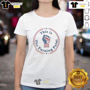 Charlie Kirk fist raised in front of the US flag on a stylish ladies tee, showcasing patriotism and empowerment.