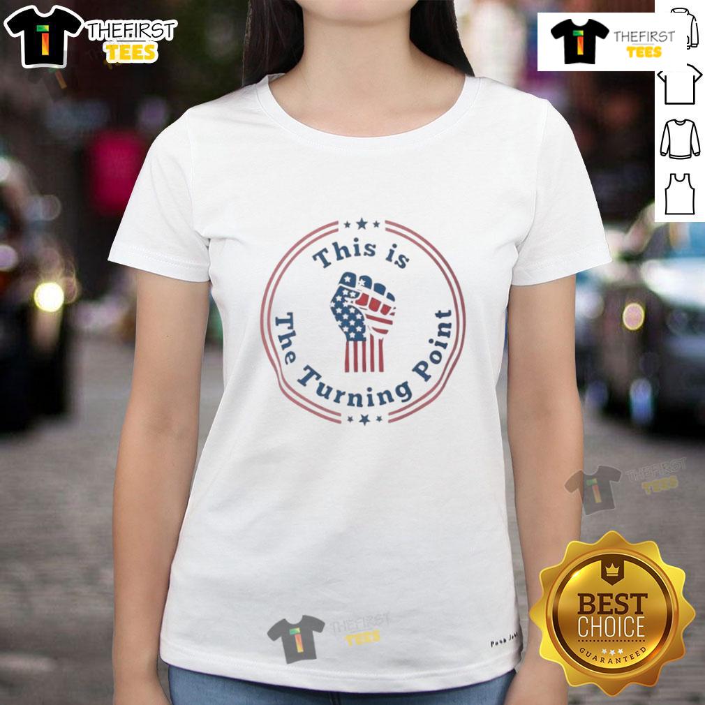 Charlie Kirk fist raised in front of the US flag on a stylish ladies tee, showcasing patriotism and empowerment.