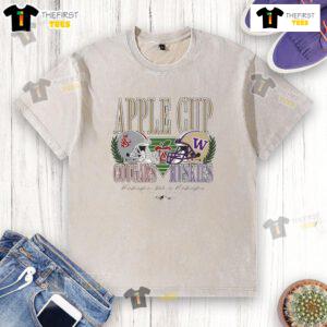 Alt Text: Top Washington State Cougars and Washington Huskies football Apple Cup rivalry helmet on a washed T-shirt.
