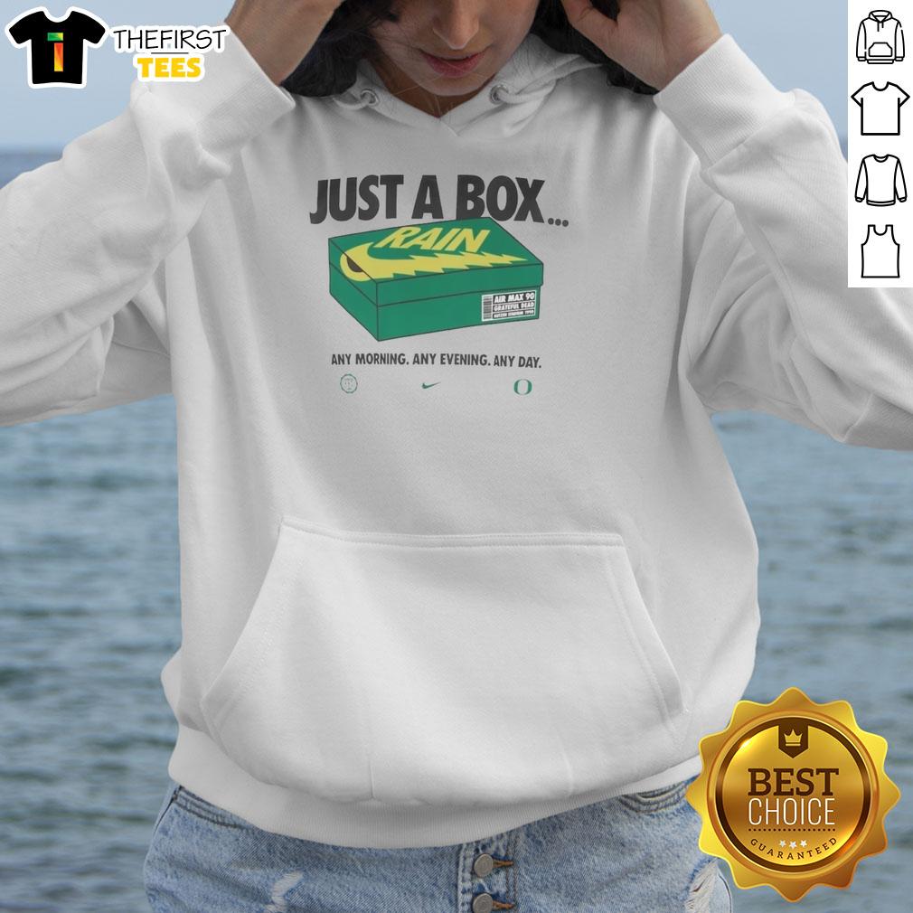 Alt Text: Official Oregon Ducks Box Of Rain hoodie displayed on a table, showcasing team colors and logo for fans.