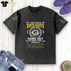 Premium washed t-shirt featuring 'I May Live In North Dakota, But My Heart Belongs To Green Bay Packers' design.