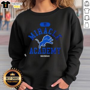 Alt Text: Premium NFL Detroit Lions Miracle Academy Nahmias Sweatshirt in blue with logo, perfect for fans and chilly days.
