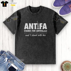 Alt Text: Washed t-shirt featuring the Statue of Liberty and 'I Stand With Her' slogan, supporting Antifa and antifascism.