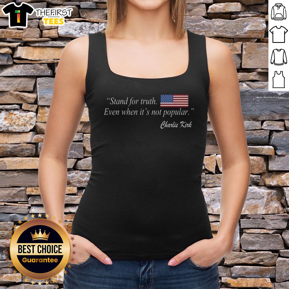 Charlie Kirk wearing a US flag tank top with the phrase 'Stand for Truth Even When It's Not Popular.'