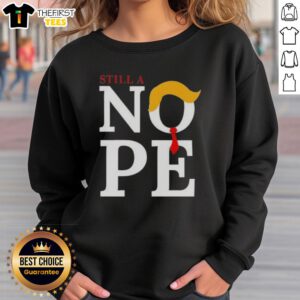 Top Still A Nope Trump Hair Sweatshirt featuring a humorous design of Trump's iconic hairstyle on a cozy sweatshirt.