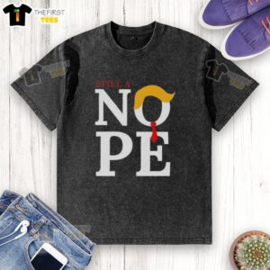 Top Still A Nope Trump Hair Washed T-Shirt featuring bold text and a humorous design for political satire fans.