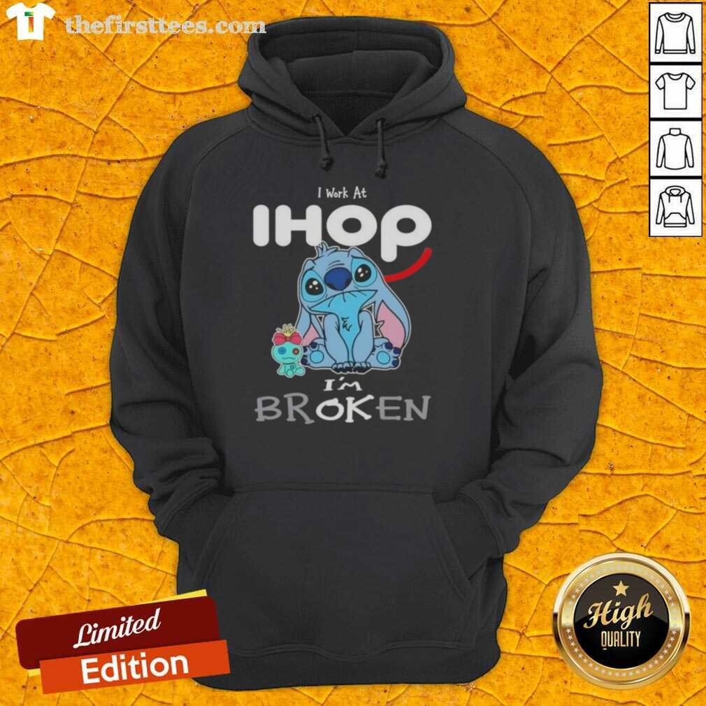 Cute Stitch hoodie featuring 'I work at IHOP, I'm broken' text, perfect for fans of Disney and cozy fashion.