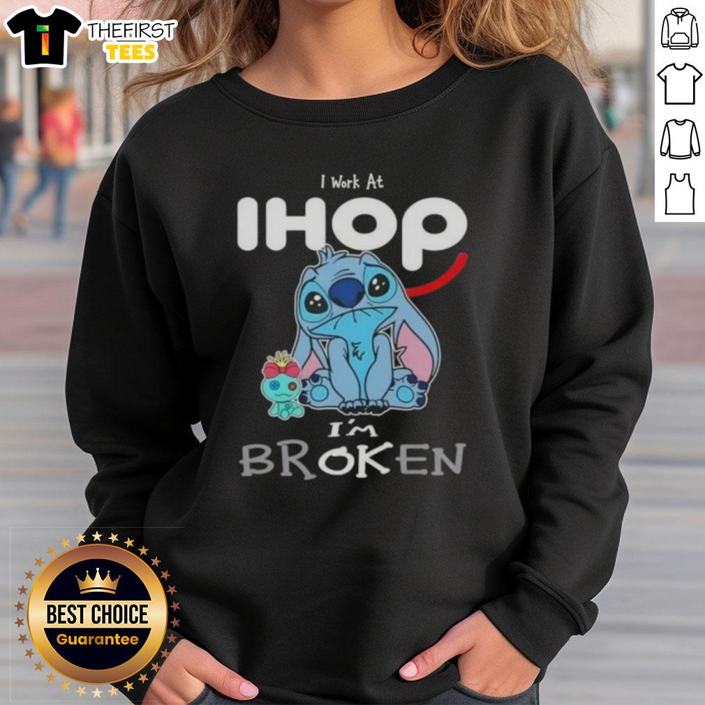 Cute Stitch sweatshirt with 'I work at IHOP, I'm broken' design, perfect for fans of Disney and cozy fashion.