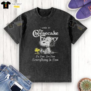 Alt Text: Cute Snoopy and Woodstock on a washed t-shirt with I work at the Cheesecake Factory, it's fine text design.