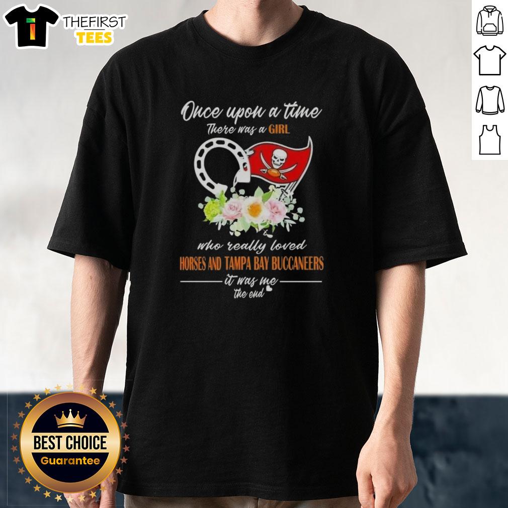 Alt Text: Girl wearing 'Once Upon A Time' T-shirt featuring horses and Tampa Bay Buccaneers logo, showcasing her love for both.