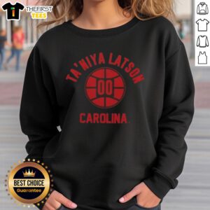 Taniya Latson poses in a stylish South Carolina basketball sweatshirt, showcasing team spirit and athletic fashion.