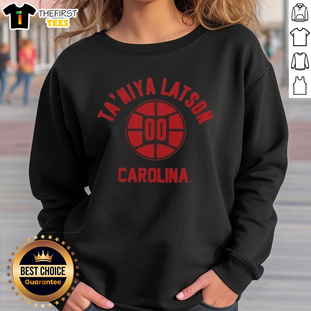 Taniya Latson poses in a stylish South Carolina basketball sweatshirt, showcasing team spirit and athletic fashion.