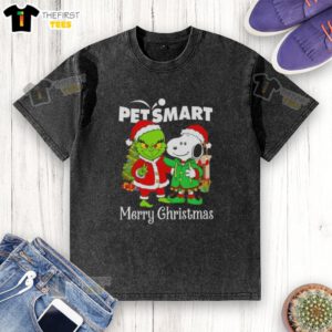 Alt Text: Cute PetSmart x Grinch and Snoopy Merry Christmas washed t-shirt featuring festive graphics and soft fabric.