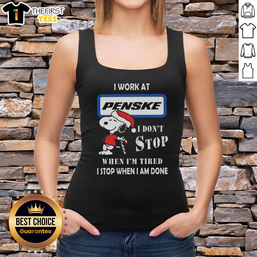 Cute Snoopy Christmas tank top with 'I Work At Penske Corporation, I Don't Stop When I'm Tired, I Stop When I'm Done' design.