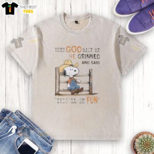 Official Peanuts Snoopy Cowboy T-shirt featuring 'When God Made Me He Grinned And Said This'll Be Fun' design.
