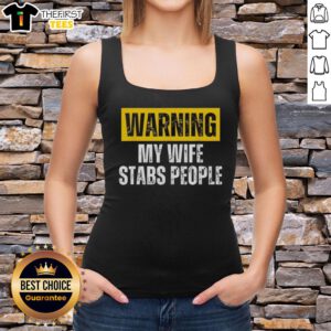 Vintage tank top featuring 'Official Warning: My Wife Stabs People' graphic, perfect for humor and unique fashion statements.