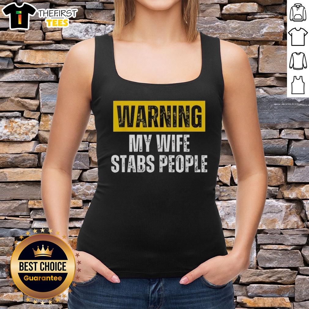 Vintage tank top featuring 'Official Warning: My Wife Stabs People' graphic, perfect for humor and unique fashion statements.
