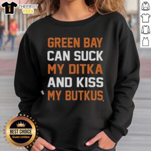 Alt Text: Premium Green Bay Can Suck My Ditka and Kiss My Butkus Sweatshirt featuring bold text on a cozy fabric background.