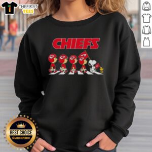 Premium Kansas City Chiefs X Peanuts Snoopy and Friends Abbey Road sweatshirt featuring iconic characters in vibrant design.