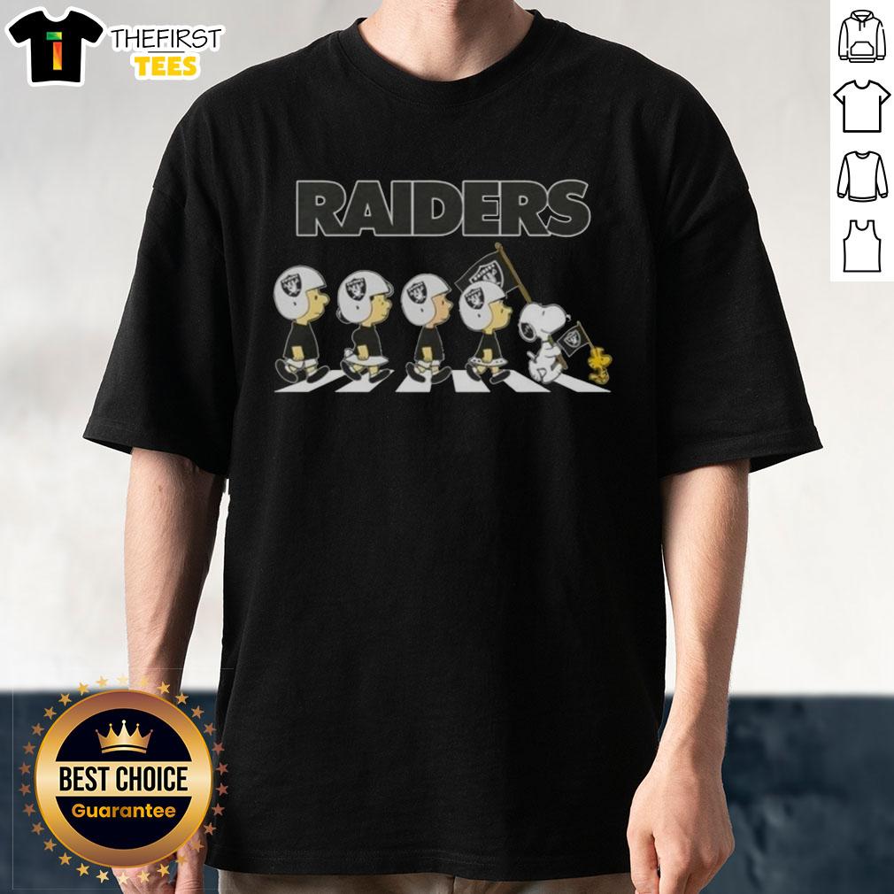 Alt Text: Premium Las Vegas Raiders X Peanuts Snoopy and Friends Abbey Road T-Shirt featuring iconic characters and team logo.