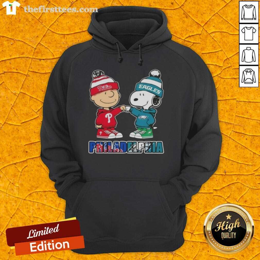 Pretty Charlie Brown fist bump hoodie featuring Snoopy, celebrating Philadelphia sports with Phillies and Eagles logos.