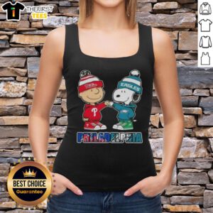 Pretty Charlie Brown fist bump with Snoopy on a Philadelphia City Sports tank top featuring Phillies and Eagles logos.