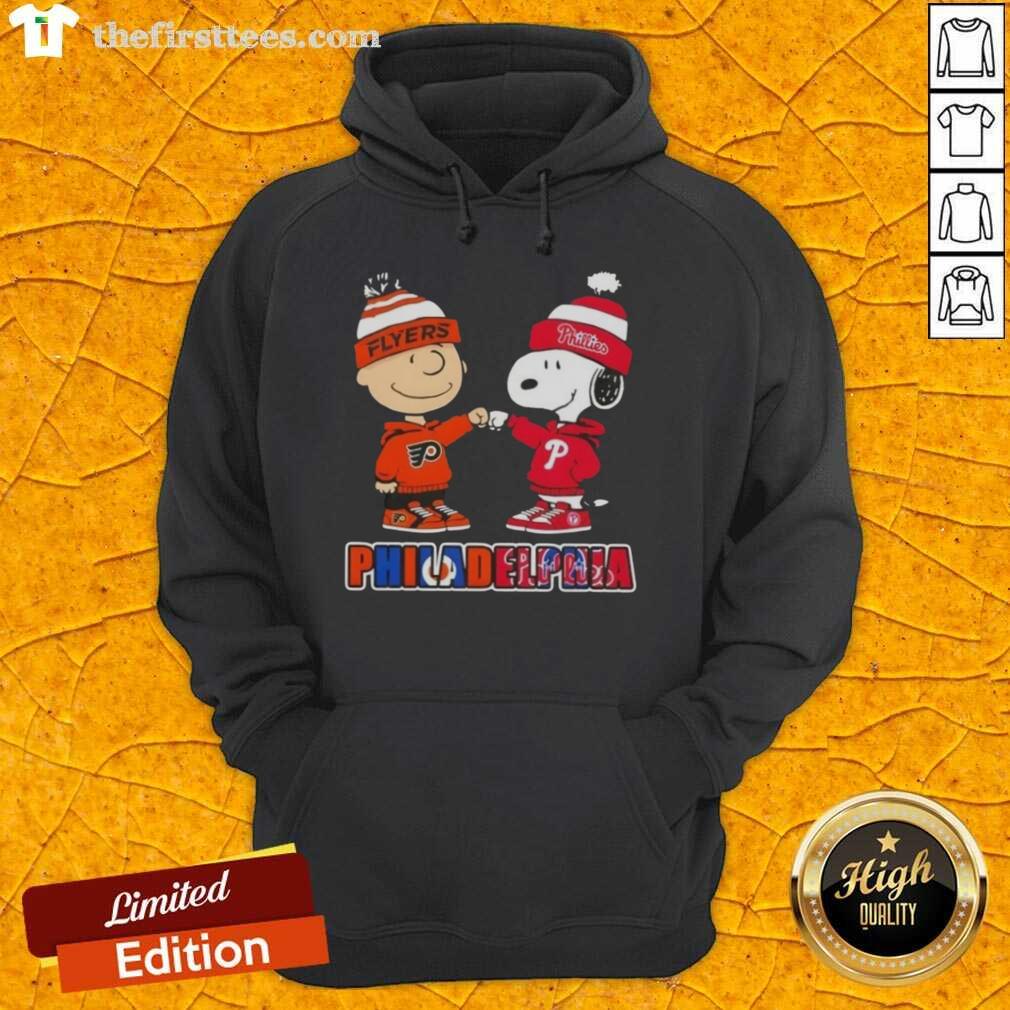 Pretty Charlie Brown Fist Bump with Snoopy on a Philadelphia City Sports Phillies X Flyers hoodie.