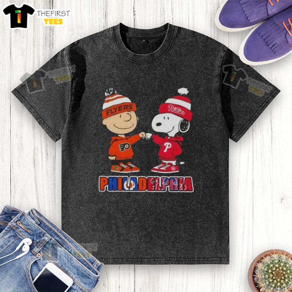 Pretty Charlie Brown fist bumping Snoopy in a Philadelphia City Sports Phillies X Flyers washed t-shirt design.