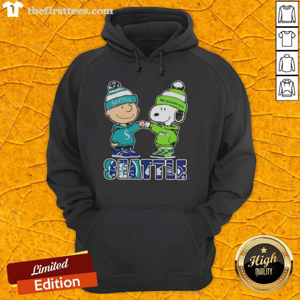 Pretty Charlie Brown fist bump with Snoopy in Seattle sports hoodie for Mariners X Seahawks, showcasing team spirit.