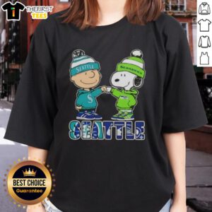 Pretty Charlie Brown fist bump with Snoopy, representing Seattle sports pride for Mariners and Seahawks on ladies tee.
