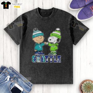 Pretty Charlie Brown fist bump with Snoopy, featuring Seattle Mariners and Seahawks logos on a washed t-shirt.