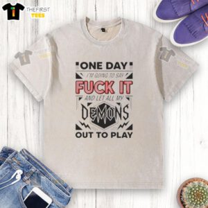 Alt Text: Washed t-shirt with 'Pretty One Day I'm Going to Say F* It Demons and Let All My Out to Play' graphic design.