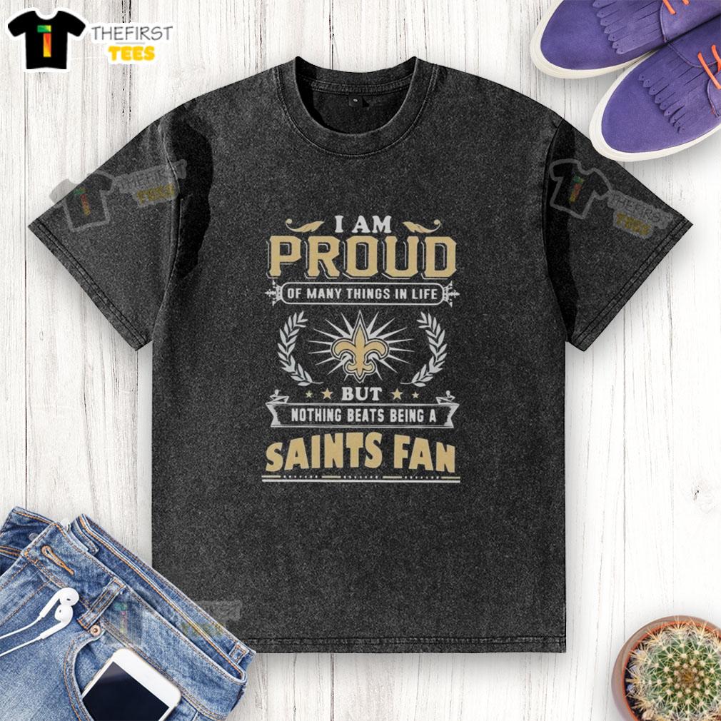 New Orleans Saints fan proudly wearing a washed T-shirt, showcasing love for football and team spirit.