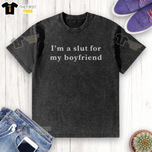 Top Im A Slut For My Boyfriend washed t-shirt displayed on a hanger, showcasing casual style and playful message.