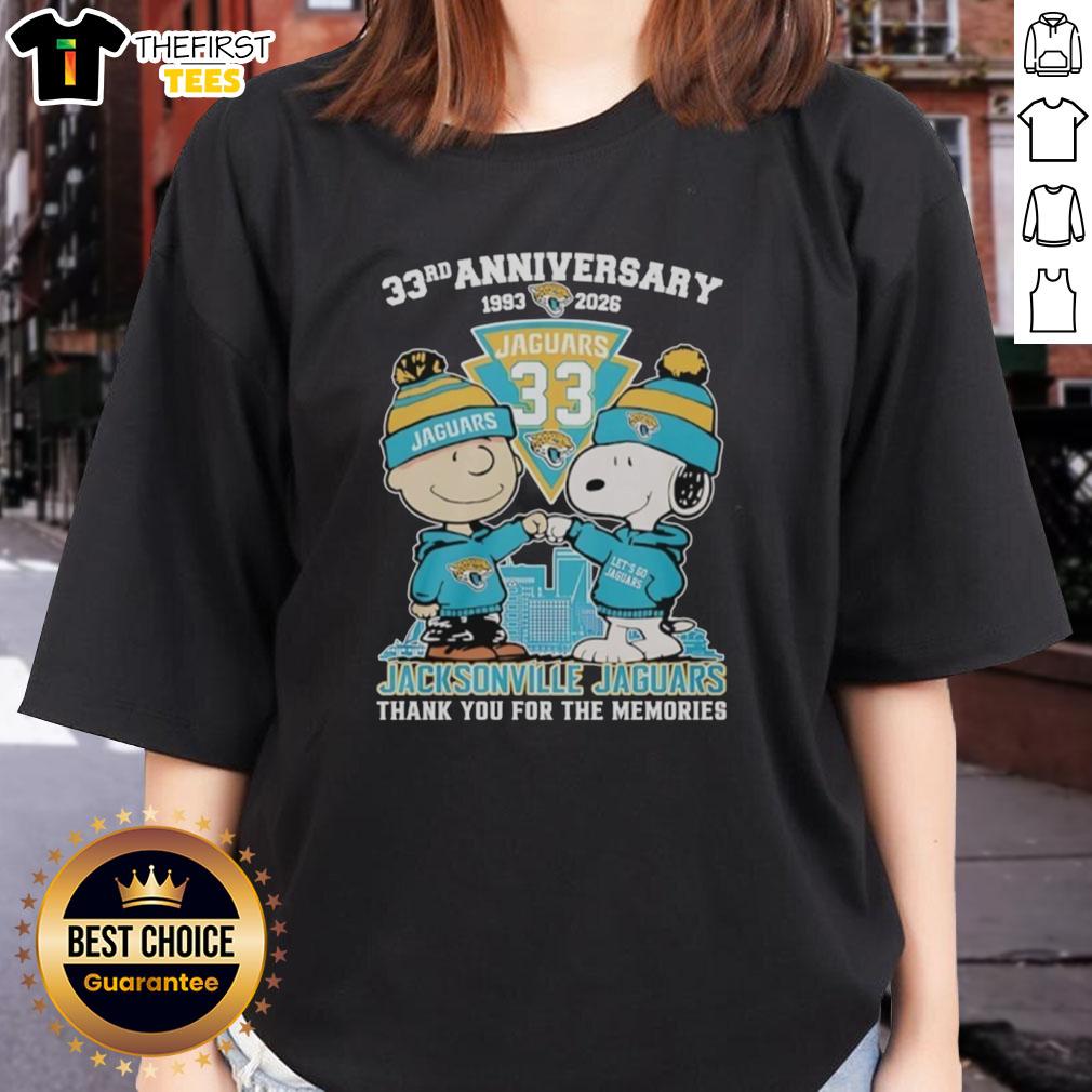 Top Jacksonville Jaguars outfit featuring Snoopy and Charlie Brown 33rd Anniversary 1993-2026 ladies tee design.